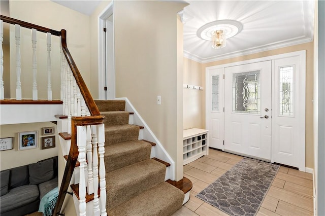 227 Shady Knoll Dr, Scott Twp Sal, PA 15220 - foyer entrance with stairs, crown molding, a chandelier, wood finish floors, and baseboards