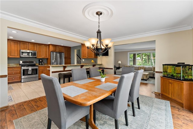 227 Shady Knoll Dr, Scott Twp Sal, PA 15220 - dining space featuring a chandelier, ornamental molding, light wood-style floors, and recessed lighting