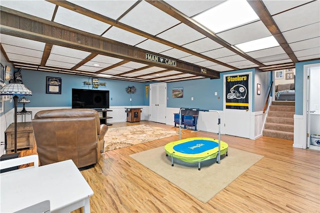 227 Shady Knoll Dr, Scott Twp Sal, PA 15220 - living area featuring stairs, wood finished floors, and wainscoting
