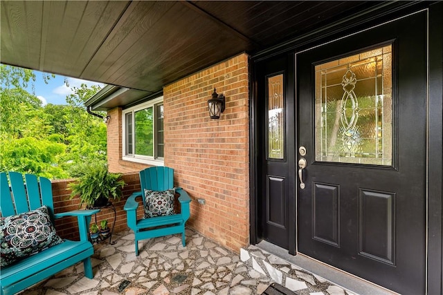 227 Shady Knoll Dr, Scott Twp Sal, PA 15220 - doorway to property with brick siding and a porch