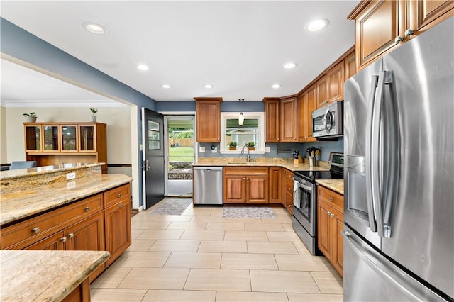 227 Shady Knoll Dr, Scott Twp Sal, PA 15220 - kitchen with stainless steel appliances, a sink, brown cabinets, light stone counters, and recessed lighting