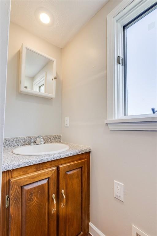 149-151 French St, Hempfield Twp Wml, PA 15601 - bathroom featuring vanity, baseboards, and plenty of natural light