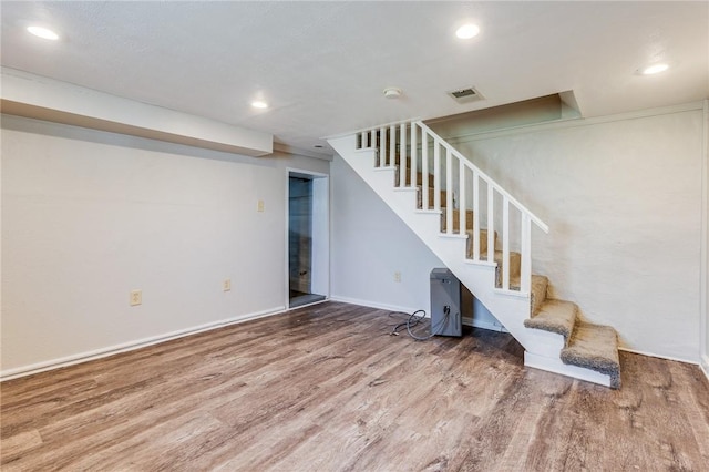 149-151 French St, Hempfield Twp Wml, PA 15601 - finished below grade area with wood finished floors, stairs, recessed lighting, and baseboards