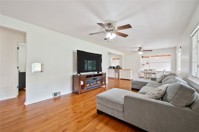 3702 School Rd, Murrysville, PA 15668 - living area with ceiling fan and light wood-style flooring