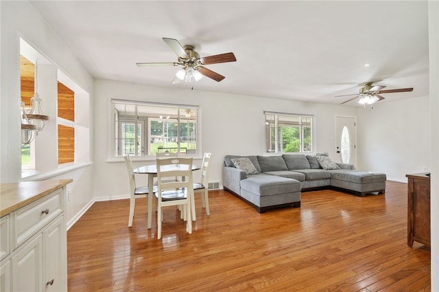 3702 School Rd, Murrysville, PA 15668 - living room featuring ceiling fan, light wood-type flooring, and baseboards