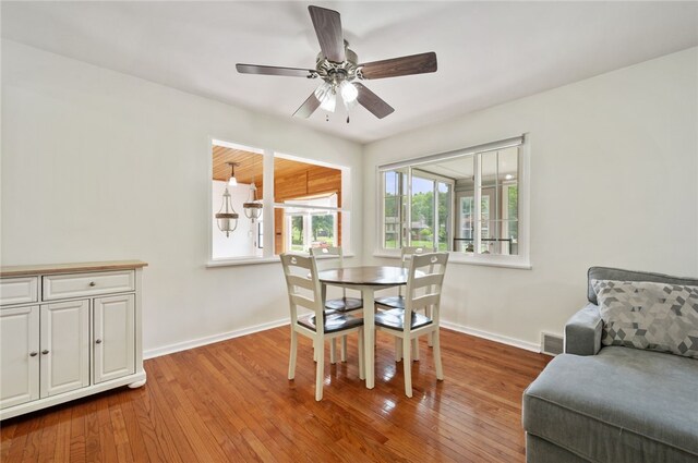 3702 School Rd, Murrysville, PA 15668 - dining area featuring wood finished floors, a ceiling fan, and baseboards
