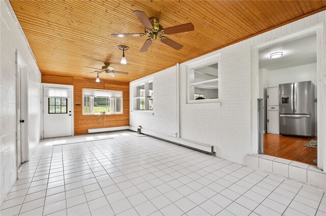 3702 School Rd, Murrysville, PA 15668 - unfurnished sunroom with baseboard heating and plenty of natural light