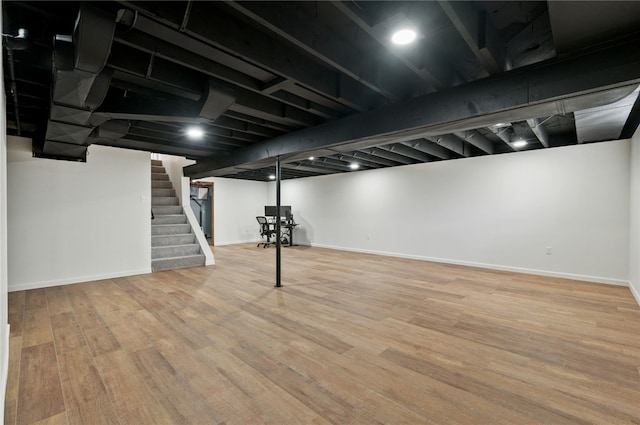 3702 School Rd, Murrysville, PA 15668 - finished below grade area featuring stairs, wood finished floors, and baseboards