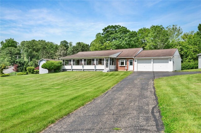 3702 School Rd, Murrysville, PA 15668 - single story home featuring a garage, driveway, a front lawn, and view of scattered trees