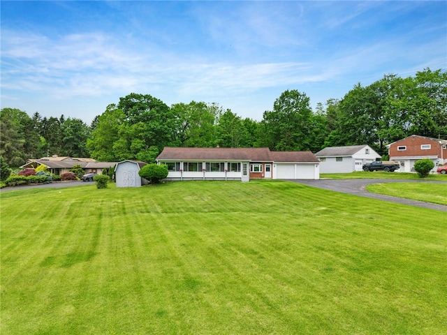 3702 School Rd, Murrysville, PA 15668 - view of front facade with driveway, a front yard, and an attached garage