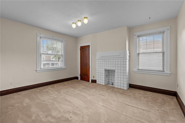 1623 Villanova, Morningside, PA 15206 - unfurnished living room featuring carpet floors, baseboards, and a tile fireplace