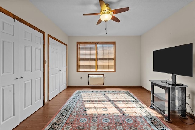 1623 Villanova, Morningside, PA 15206 - unfurnished bedroom featuring wood finished floors, baseboards, a wall mounted AC, ceiling fan, and multiple closets