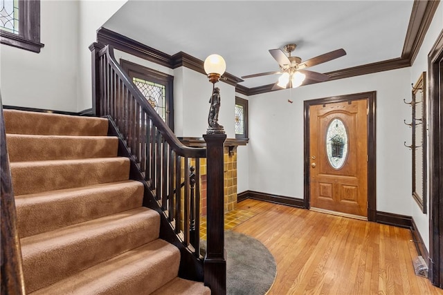 1623 Villanova, Morningside, PA 15206 - foyer with baseboards, stairs, light wood-style flooring, crown molding, and a ceiling fan