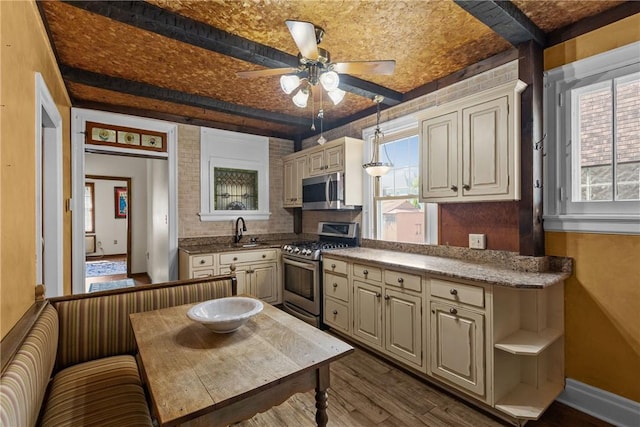 1623 Villanova, Morningside, PA 15206 - kitchen featuring stainless steel appliances, cream cabinetry, a sink, dark wood-style floors, and ceiling fan