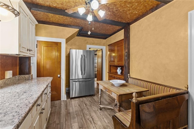 1623 Villanova, Morningside, PA 15206 - kitchen featuring freestanding refrigerator, hardwood / wood-style flooring, a ceiling fan, white cabinetry, and light stone counters