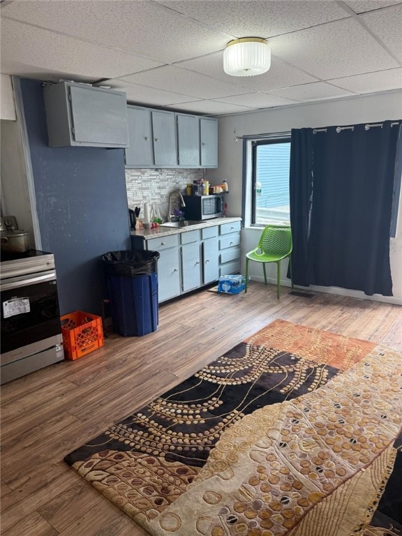 1704 High St, Spring Garden, PA 15212 - kitchen with appliances with stainless steel finishes, light countertops, light wood-style flooring, and a drop ceiling