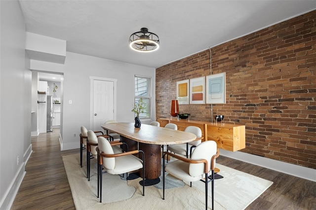 2532 Larkins Way S, Side, PA 15203 - dining area featuring wood finished floors, brick wall, and baseboards