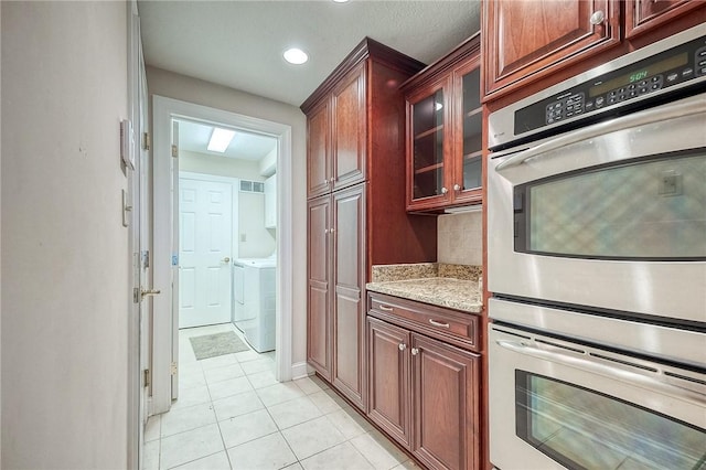 4115 Duckhorn Dr, Moon/Crescent Twp, PA 15108 - kitchen featuring stainless steel double oven, light tile patterned floors, light stone countertops, glass insert cabinets, and recessed lighting