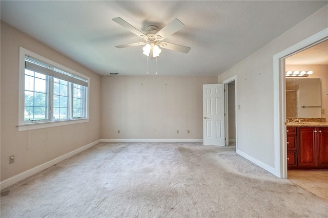 4115 Duckhorn Dr, Moon/Crescent Twp, PA 15108 - unfurnished bedroom with light carpet, baseboards, ensuite bathroom, and ceiling fan