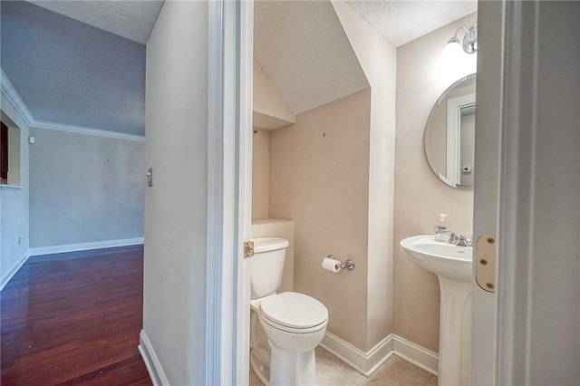 4115 Duckhorn Dr, Moon/Crescent Twp, PA 15108 - half bathroom with toilet, baseboards, a textured ceiling, wood finished floors, and a sink