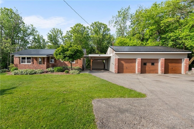 988 Croft Rd, Salem Twp Wml, PA 15601 - view of front facade with a front yard, brick siding, and driveway
