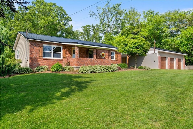988 Croft Rd, Salem Twp Wml, PA 15601 - view of front facade with a front yard, brick siding, and a garage
