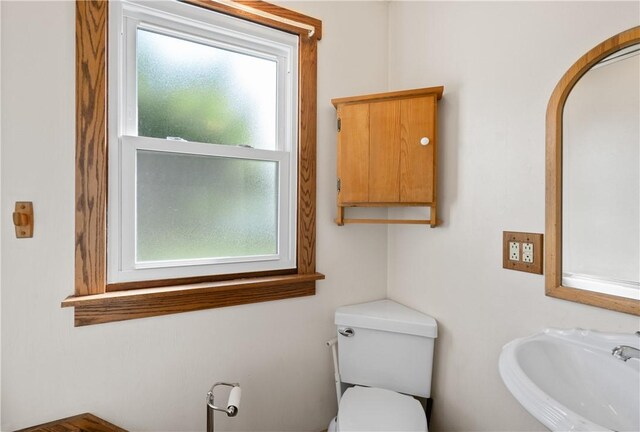 988 Croft Rd, Salem Twp Wml, PA 15601 - half bathroom with healthy amount of natural light, a sink, and toilet