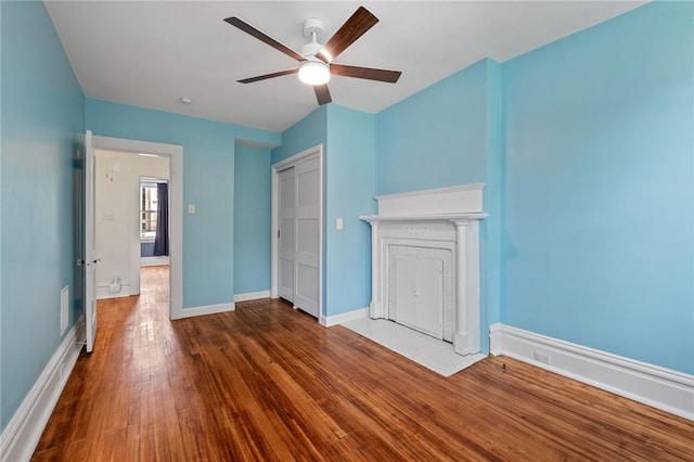 1105 Chislett St, Morningside, PA 15206 - unfurnished bedroom with wood finished floors, baseboards, a closet, and ceiling fan