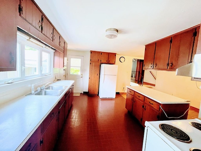 1720 Saltsburg Ave, White Twp Ind, PA 15701 - kitchen with freestanding refrigerator, light countertops, a sink, range hood, and dark floors