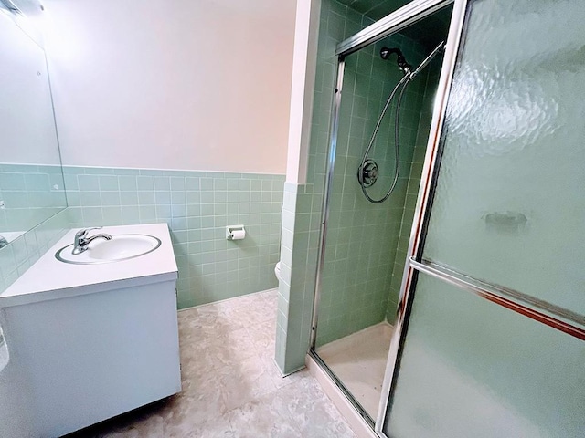 1720 Saltsburg Ave, White Twp Ind, PA 15701 - full bath with vanity, a stall shower, tile walls, wainscoting, and tile patterned flooring
