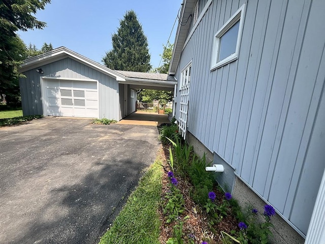 1720 Saltsburg Ave, White Twp Ind, PA 15701 - view of side of home featuring driveway, a carport, and board and batten siding
