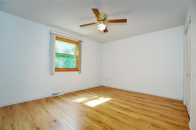 317 Fairview Dr, Manor, PA 15642 - spare room with wood finished floors, ceiling fan, and baseboards