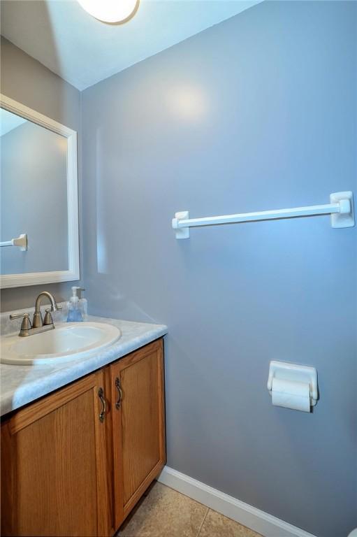 317 Fairview Dr, Manor, PA 15642 - bathroom with vanity, baseboards, and tile patterned flooring