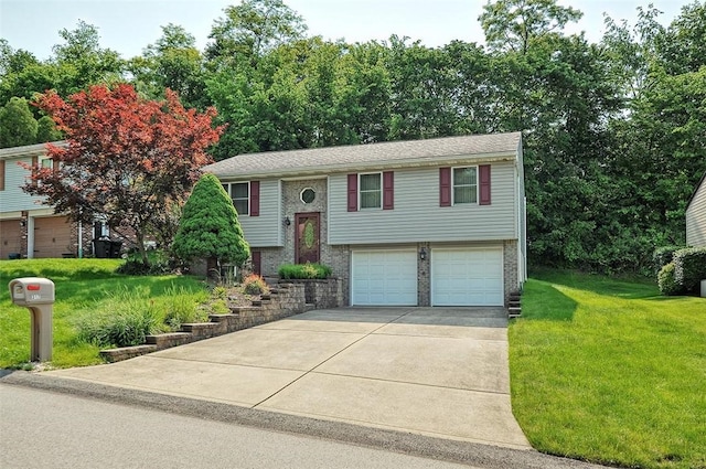 317 Fairview Dr, Manor, PA 15642 - raised ranch with a garage, driveway, a front yard, and brick siding