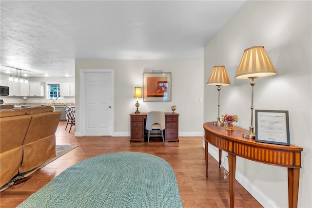 2246 Shannon Mills Dr, Connoquenessing Twp, PA 16053 - living area with wood finished floors and baseboards