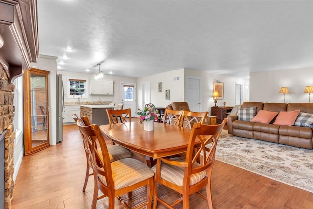 2246 Shannon Mills Dr, Connoquenessing Twp, PA 16053 - dining space with light wood-type flooring