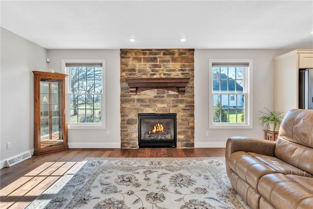 2246 Shannon Mills Dr, Connoquenessing Twp, PA 16053 - living room with wood finished floors, a fireplace, baseboards, and recessed lighting