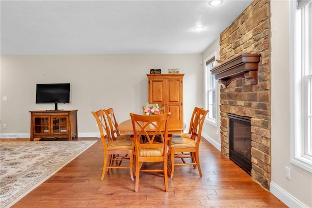 2246 Shannon Mills Dr, Connoquenessing Twp, PA 16053 - dining area featuring a fireplace, healthy amount of natural light, baseboards, and recessed lighting
