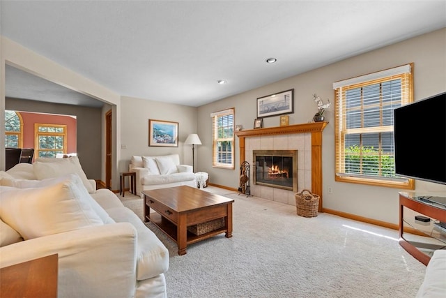 1616 Norman Dr, Franklin Park, PA 15143 - carpeted living room with healthy amount of natural light, a tiled fireplace, and recessed lighting