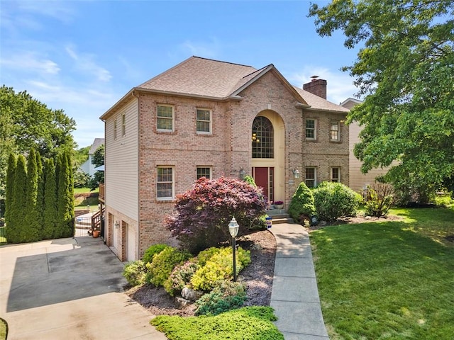 1616 Norman Dr, Franklin Park, PA 15143 - traditional-style home with brick siding, an attached garage, a chimney, driveway, and a front lawn