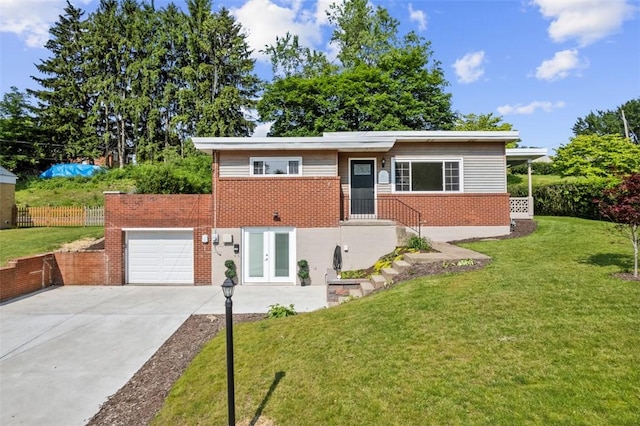 162 E Wedgewood Dr, Ross Twp, PA 15229 - view of front of house with brick siding, french doors, concrete driveway, and a garage
