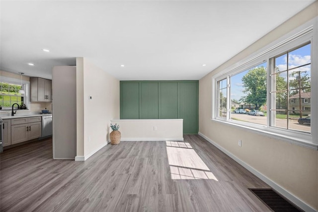 162 E Wedgewood Dr, Ross Twp, PA 15229 - empty room with light wood-type flooring, baseboards, a sink, and recessed lighting