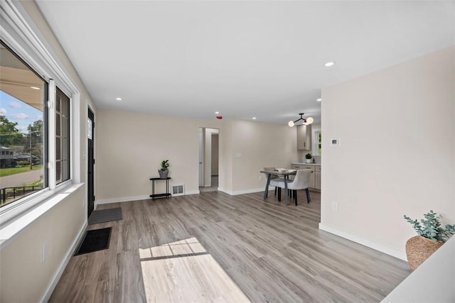 162 E Wedgewood Dr, Ross Twp, PA 15229 - unfurnished living room with light wood-style flooring, recessed lighting, and baseboards