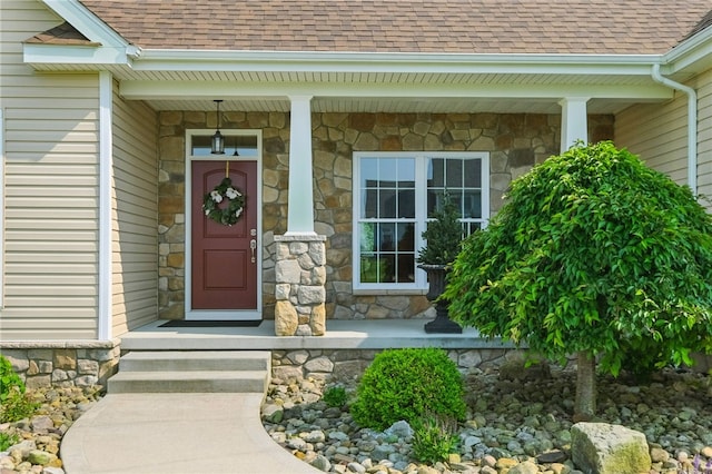 112 Savannah Dr, Lancaster Twp, PA 16037 - view of exterior entry featuring a shingled roof and stone siding