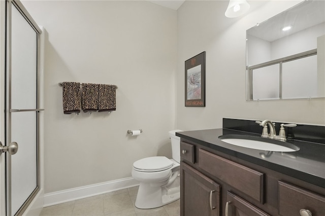112 Savannah Dr, Lancaster Twp, PA 16037 - full bathroom featuring baseboards, an enclosed shower, vanity, tile patterned floors, and toilet