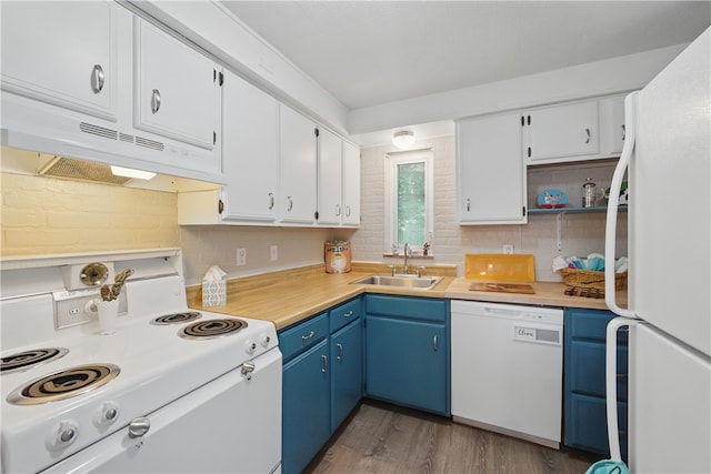 131 Spring Ave, Bellevue, PA 15202 - kitchen featuring white appliances, a sink, under cabinet range hood, blue cabinets, and decorative backsplash