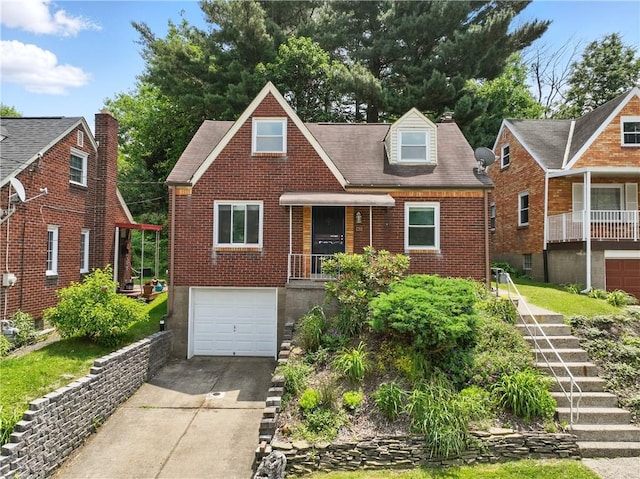 131 Spring Ave, Bellevue, PA 15202 - view of front facade with brick siding, concrete driveway, stairway, a garage, and a shingled roof