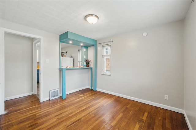 131 Spring Ave, Bellevue, PA 15202 - unfurnished living room featuring wood-type flooring and baseboards