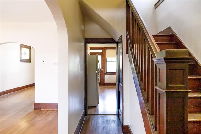 315 Wright St, Mckees Rocks, PA 15136 - staircase featuring arched walkways, wood finished floors, and baseboards