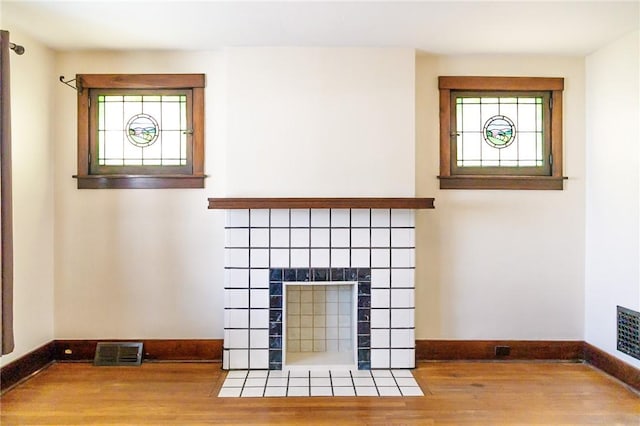 315 Wright St, Mckees Rocks, PA 15136 - detailed view of baseboards, wood finished floors, and a tile fireplace